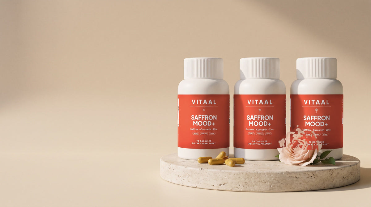 Three bottles of Saffron Mood+ on a stone plinth